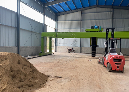 Wheel type compost turner at the site